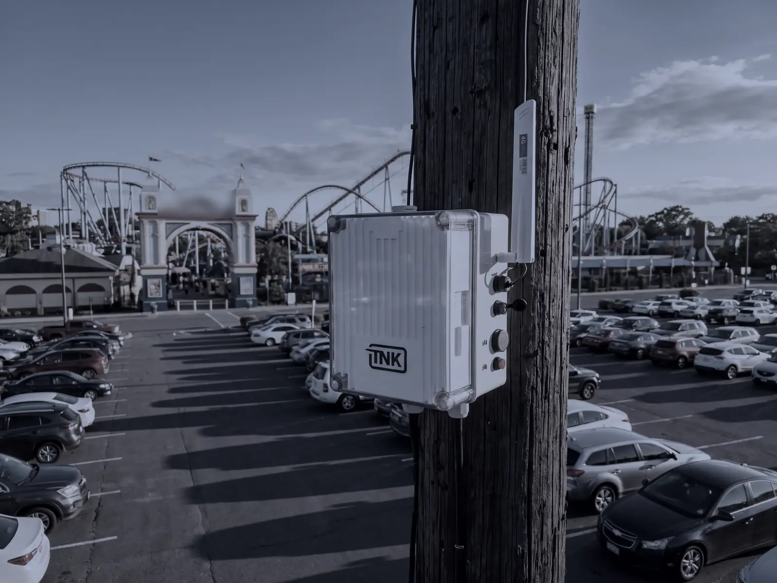 CarDefense fixed sensor on a pole above the parking lot of an amusement park